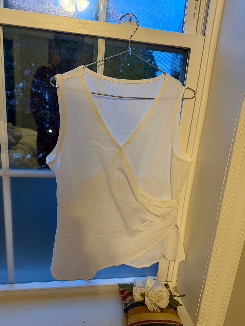Sleeveless White Wrap-Front Camisole with Cream Trim